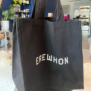 Large black reusable Erewhon tote with sleek white logo